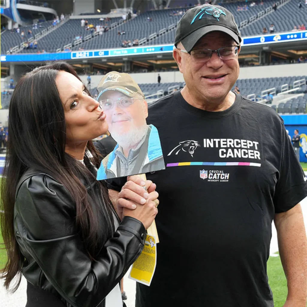 Nicole Tepper with her husband in stadium for a photo