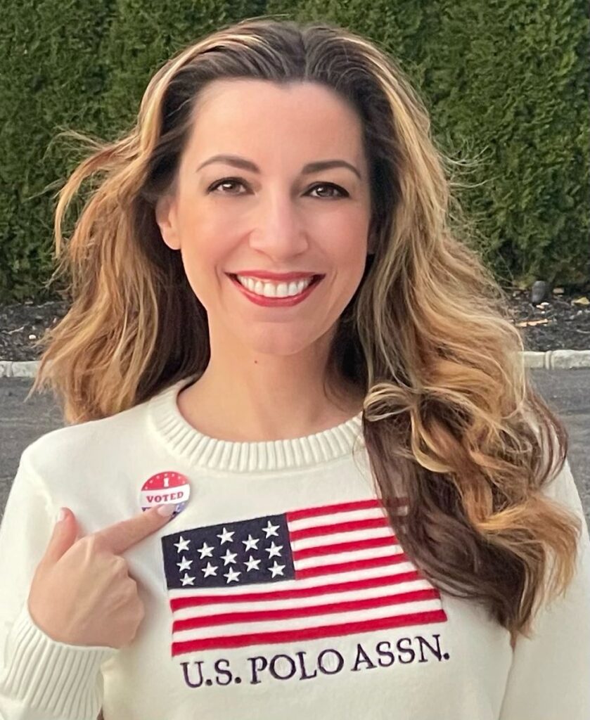 a close image of Kristy Greenberg in shirt eith us flag
